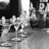 grayscale photography of margarita glass on table