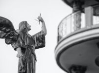 shallow focus architectural photography of angel statue